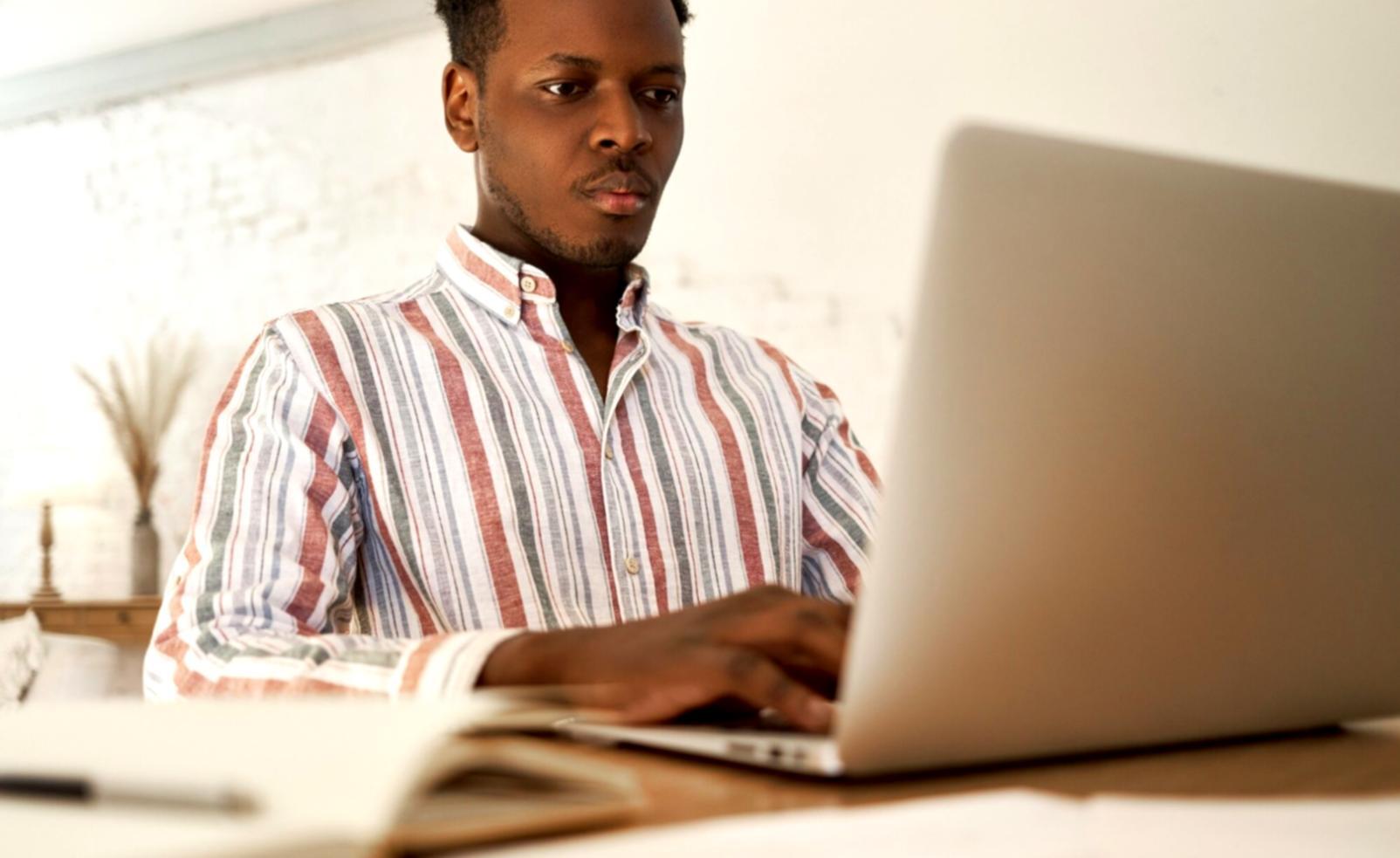Instructor demonstrating financial tracking methods on whiteboard