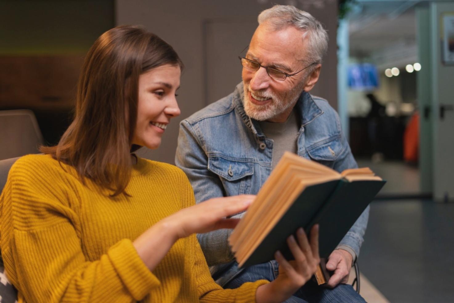 Team member analyzing financial data at workstation with multiple monitors displaying charts and stability indicators