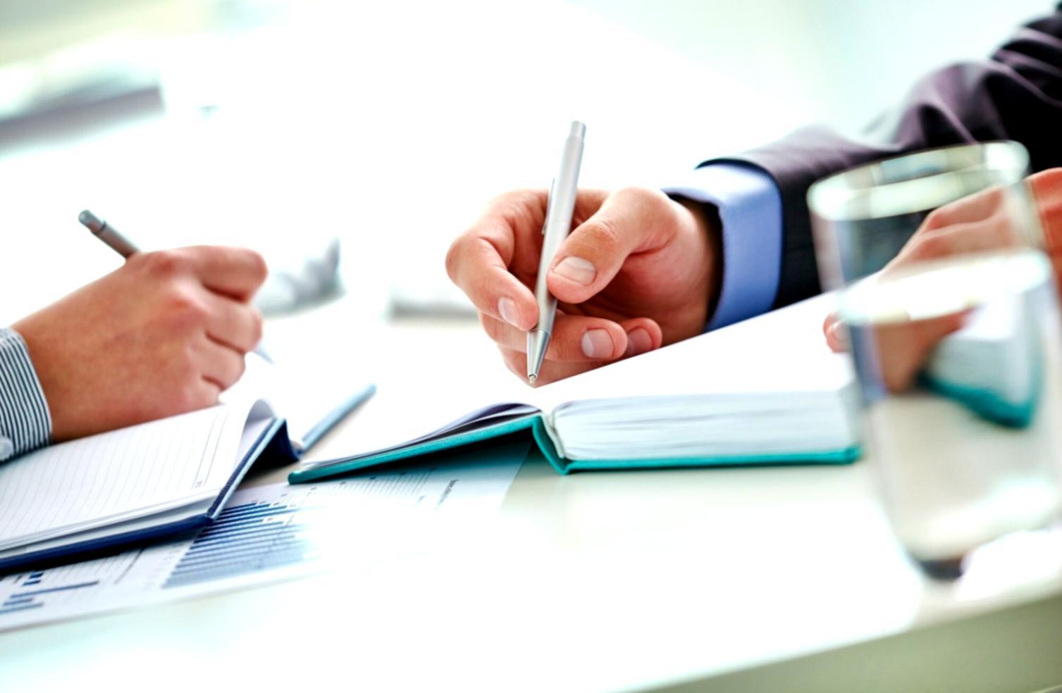 Financial planning session with charts and reports