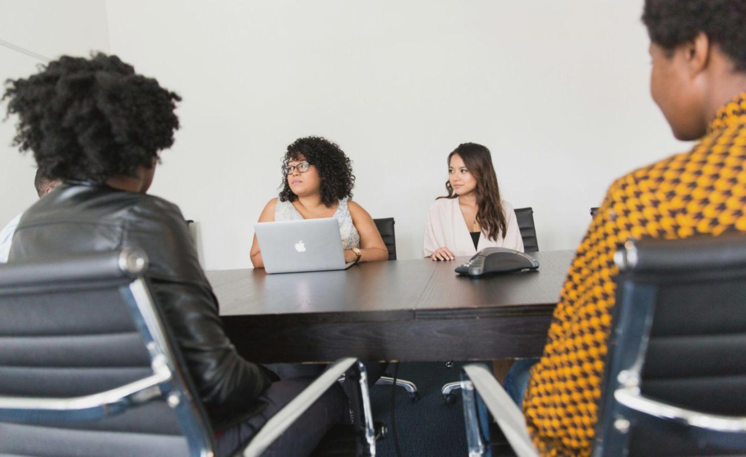 Client consultation session with financial documents and analysis materials